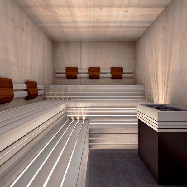 Modern minimalist sauna interior with light wood paneling, tiered benches with LED strip lighting, and wooden headrests